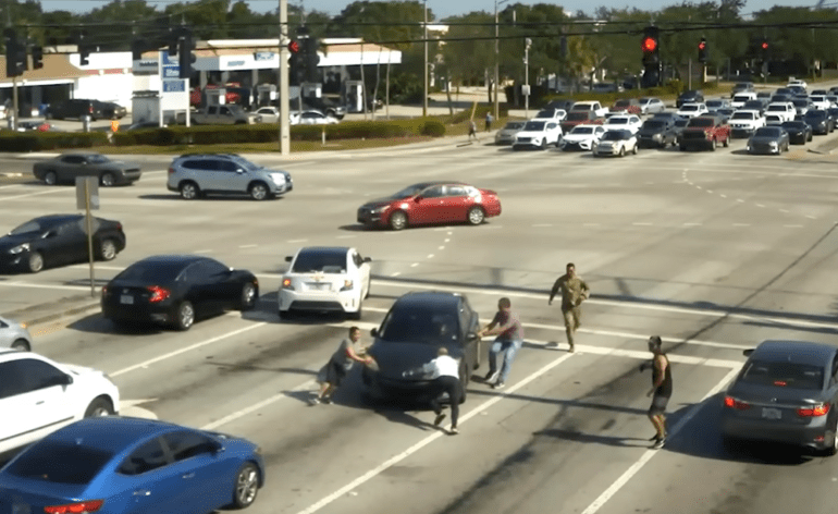 A group of people crossing a street