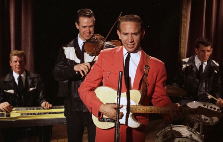 Buck Owens, Don Rich et al. are posing for a picture