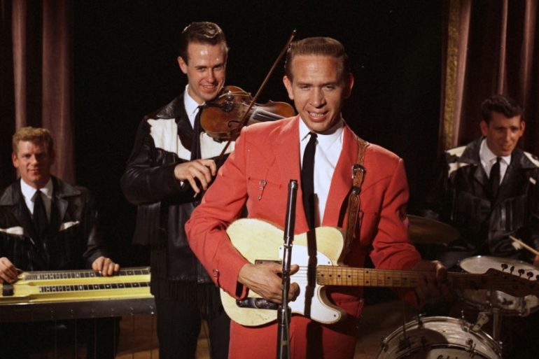 Buck Owens, Don Rich et al. are posing for a picture