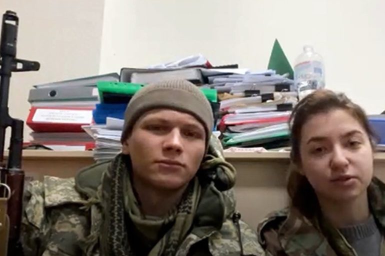 A man and woman taking a selfie