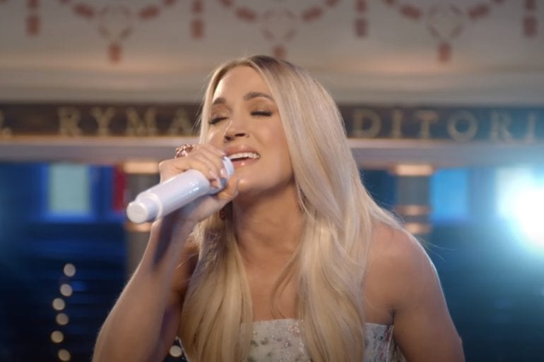 Carrie Underwood drinking from a bottle