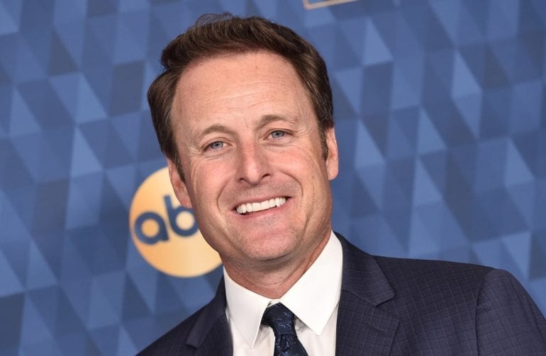 Chris Harrison in a suit smiling