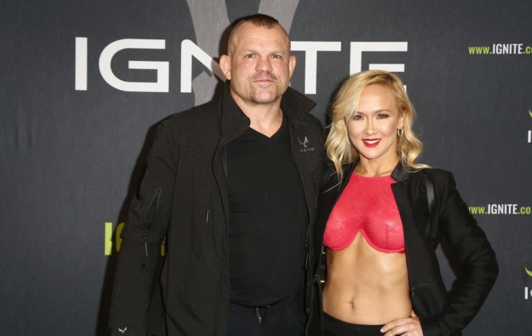 Chuck Liddell and woman posing for a picture