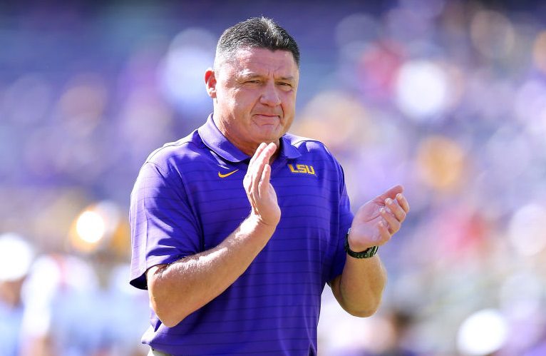 Ed Orgeron with his hands up