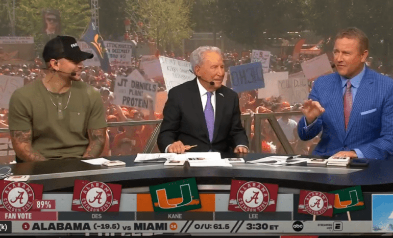 Kirk Herbstreit, Lee Corso are posing for a picture