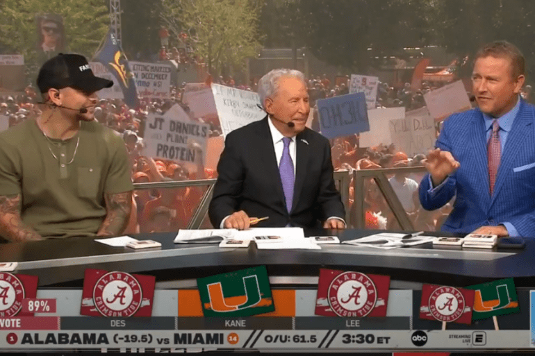Kirk Herbstreit, Lee Corso are posing for a picture