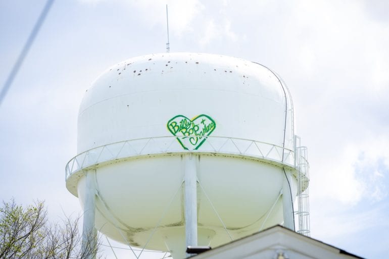 A water tower with a logo