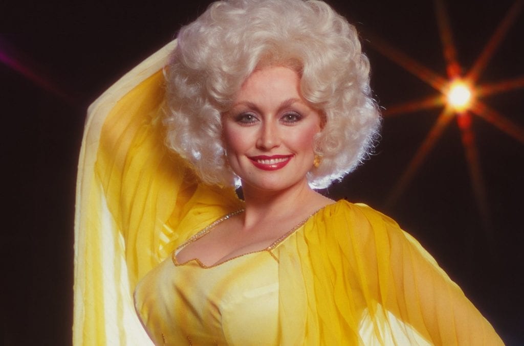 Dolly Parton in a yellow dress