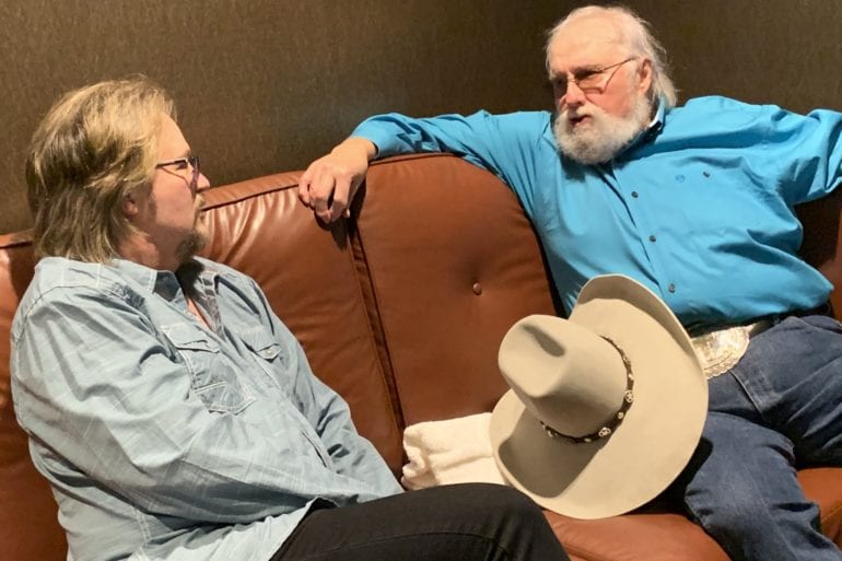 Charlie Daniels sitting on a couch with Travis Tritt
