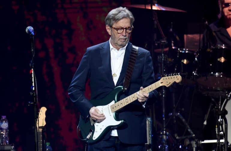 Eric Clapton playing a guitar