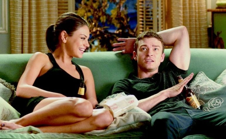 Justin Timberlake and woman sitting on a couch