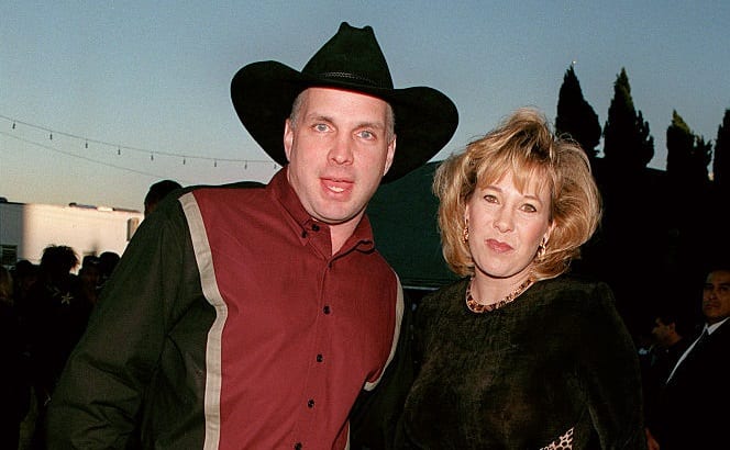 Garth Brooks and woman posing for a photo