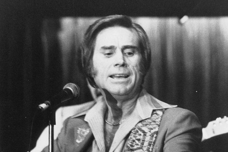 George Jones with a microphone