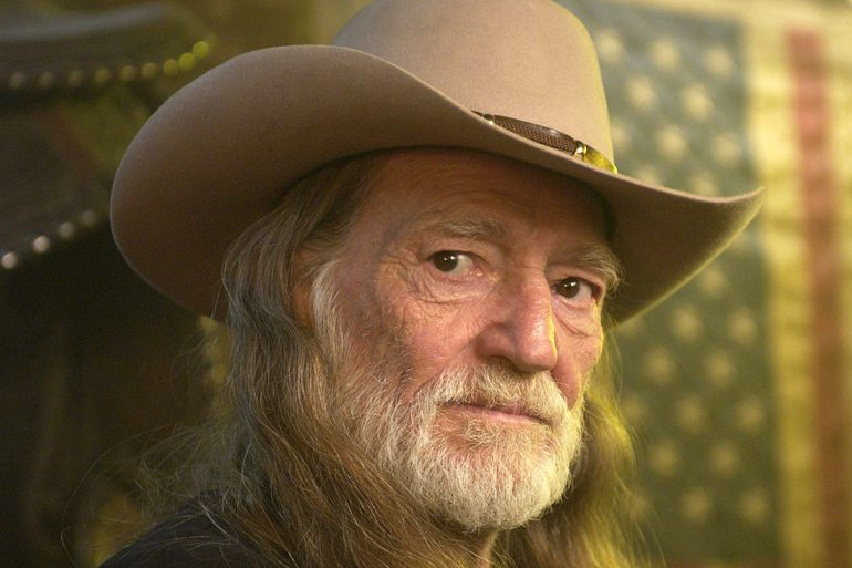 Willie Nelson with a beard and a hat