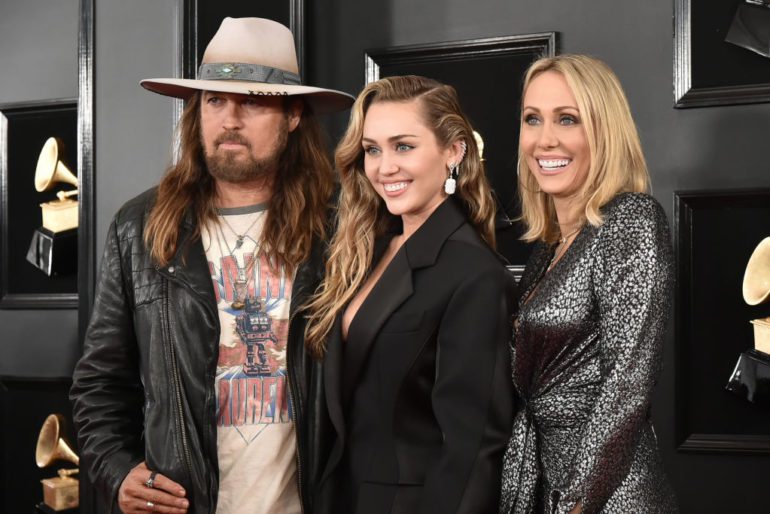 Billy Ray Cyrus, Tish Cyrus, Miley Cyrus posing for a photo