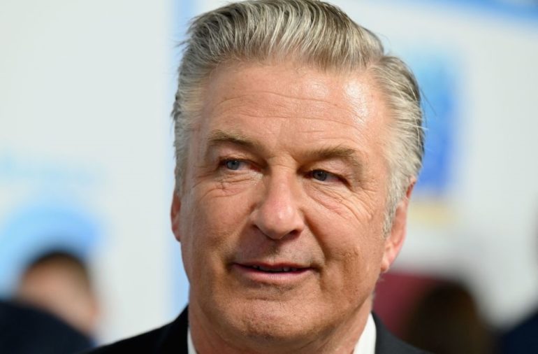 Alec Baldwin with a serious expression