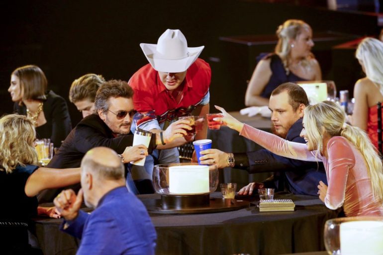 Eric Church, Luke Combs are posing for a picture