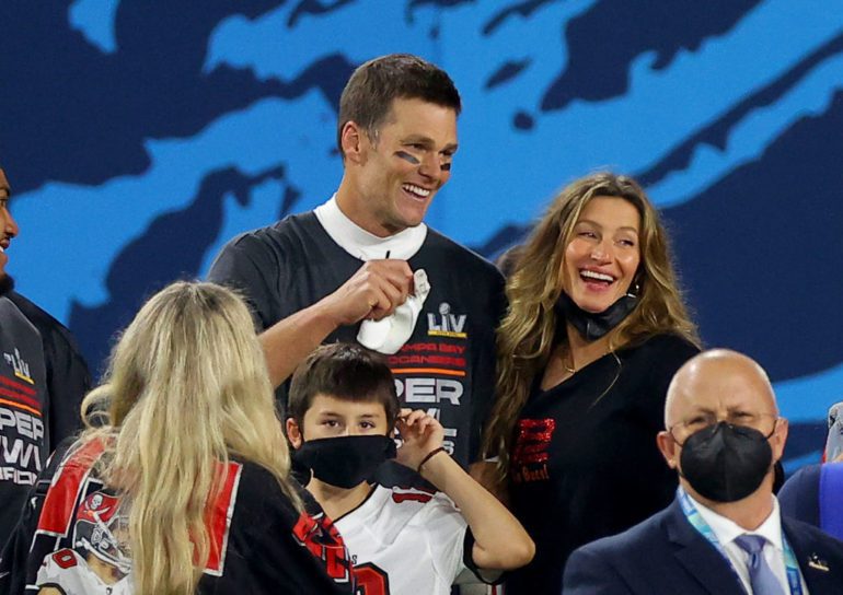 Tom Brady and woman with children