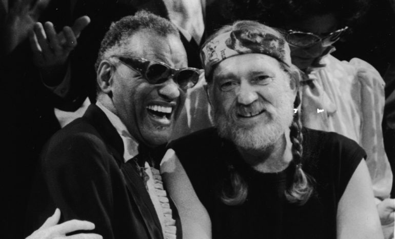 Ray Charles, Willie Nelson are posing for a picture