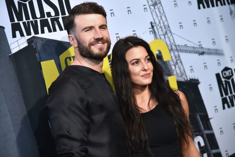 Sam Hunt and woman posing for a picture