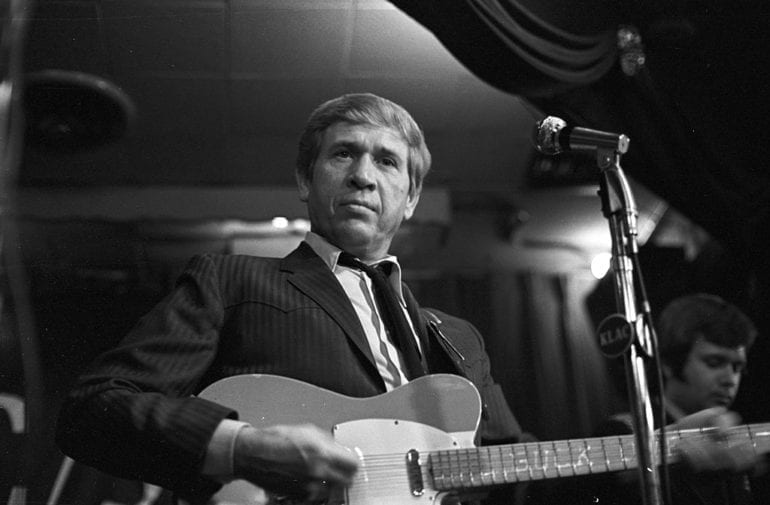 Buck Owens playing the drums