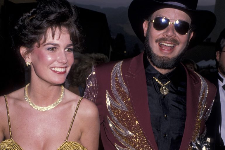 Hank Williams Jr. and woman posing for a picture