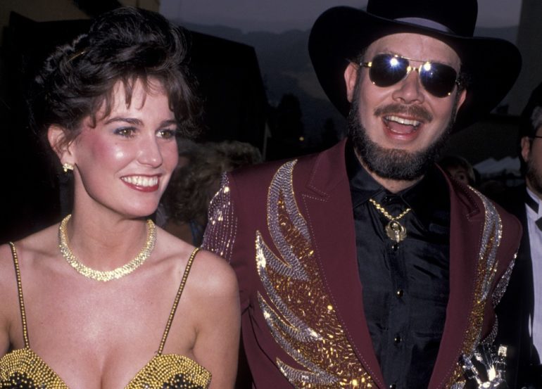 Hank Williams Jr. and woman posing for a picture