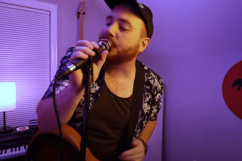 A person singing into a microphone