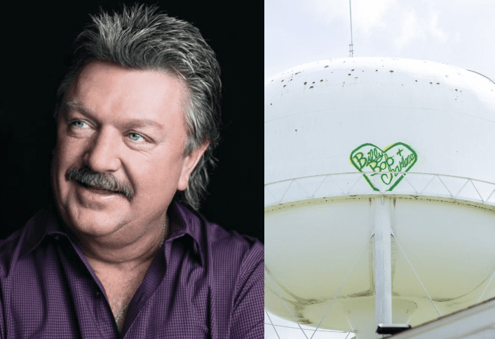 Joe Diffie smiling in front of a white satellite dish