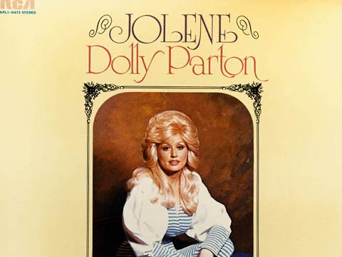 Dolly Parton with the hand on the head