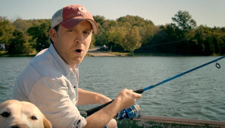 Justin Moore in a boat