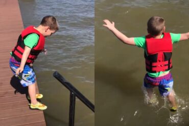 Two boys jumping into water