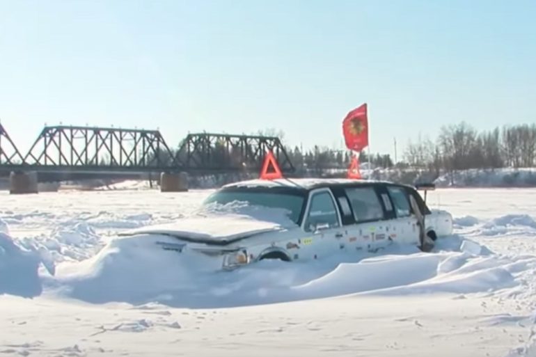 A car parked in the snow