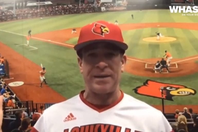 A baseball player holding a bat