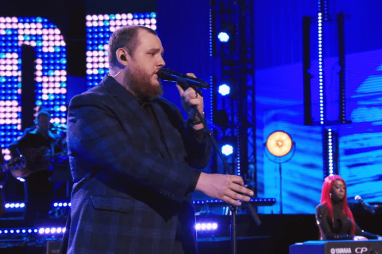 A man singing into a microphone
