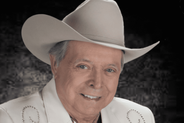 Mickey Gilley wearing a cowboy hat