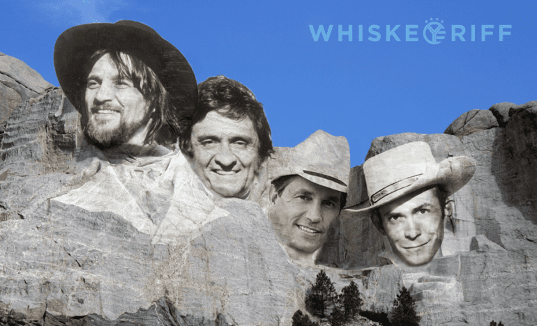 Hank Williams, George Strait, Johnny Cash, Waylon Jennings posing for the camera with Mount Rushmore National Memorial in the background