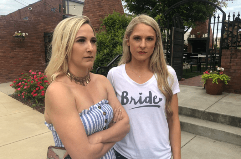 Two women standing outside