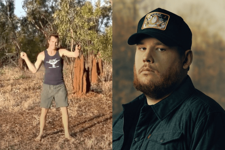Luke Combs in a hat and a person in a hat standing in a forest