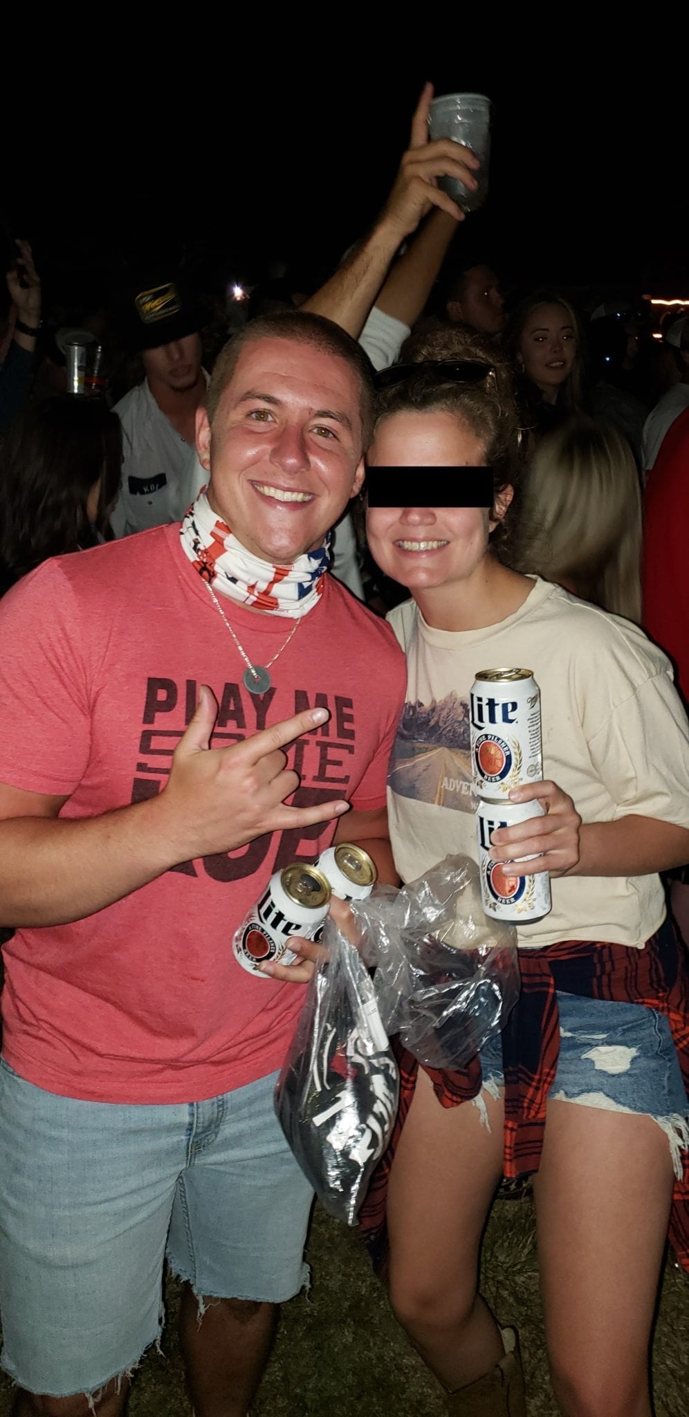 A group of people holding cans