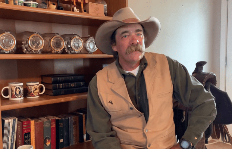 A man wearing a cowboy hat