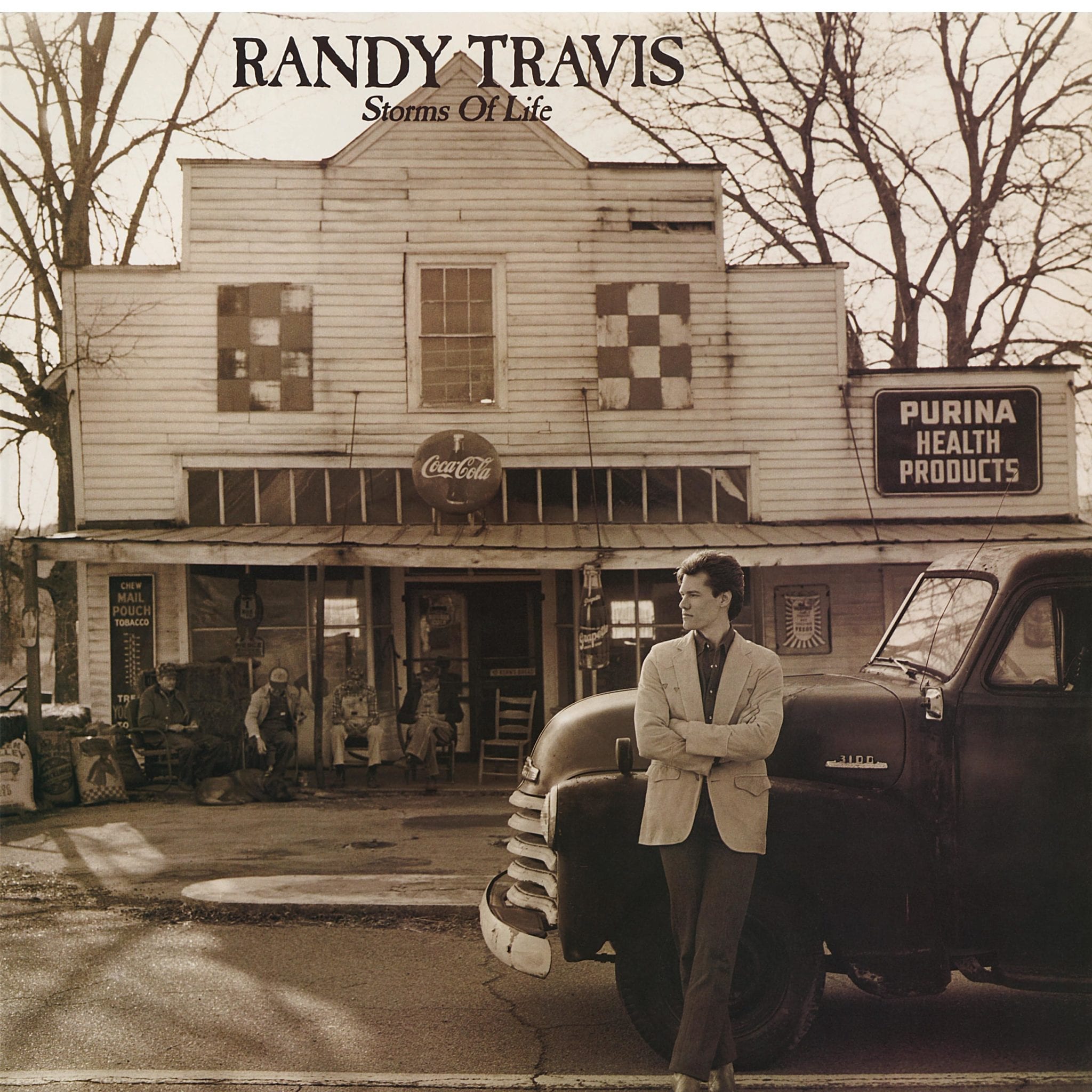 A person standing on the front of a car