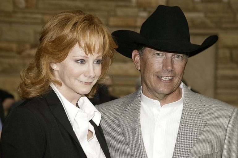 Reba McEntire and woman posing for a picture