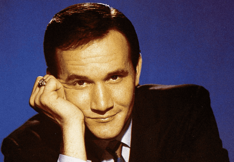 Roger Miller with a hand on his chin