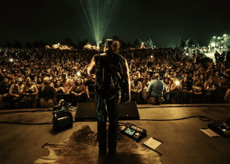 Koe Wetzel standing in front of a crowd of people
