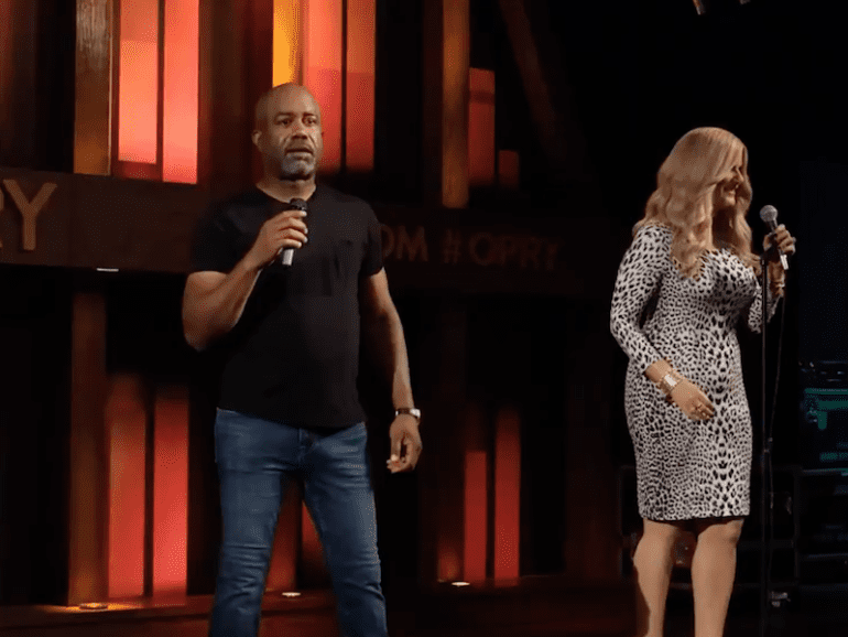 Darius Rucker and woman on stage
