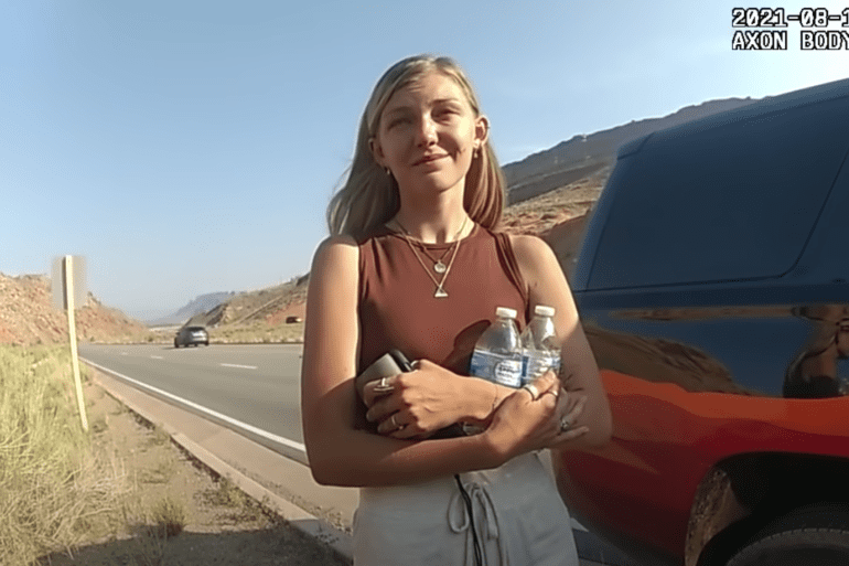 A person holding a bottle of water