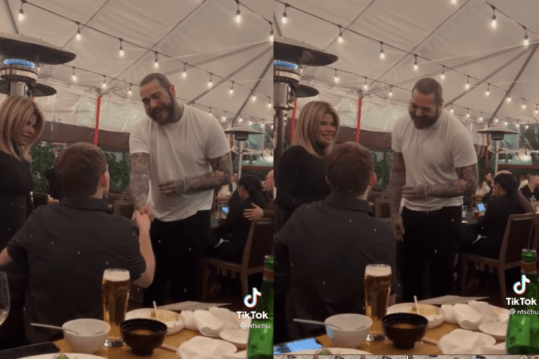 Post Malone et al. standing around a table with food and drinks