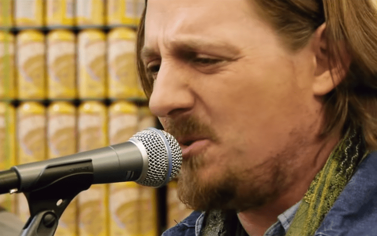 Sturgill Simpson singing into a microphone