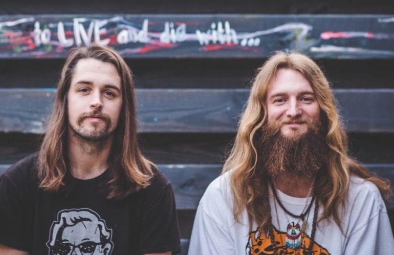 Two men with long hair